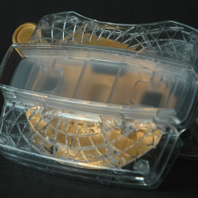 A view master with a golden interior in front of a black background.