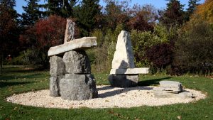 three large stone inukshuks in the Donald Forster Sculpture Park