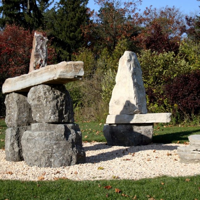 three large stone inukshuks in the Donald Forster Sculpture Park