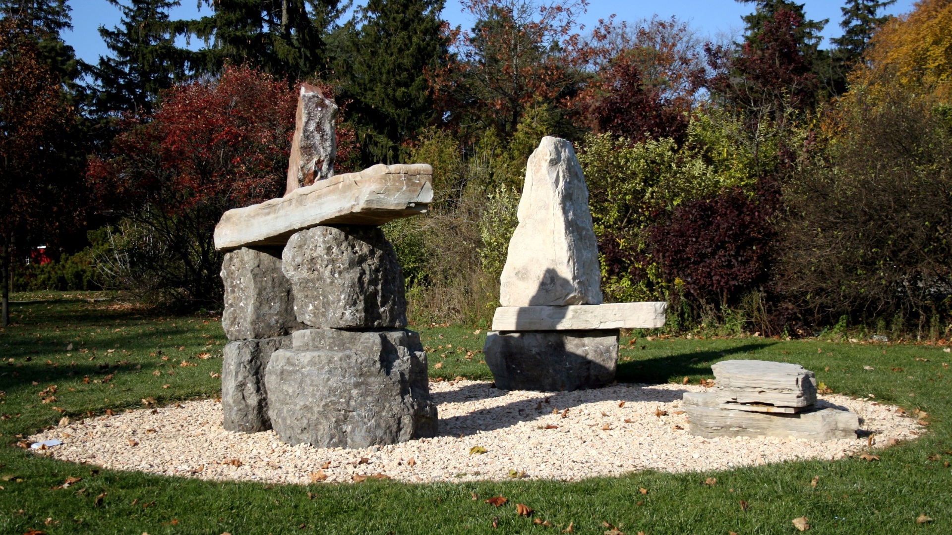 three large stone inukshuks in the Donald Forster Sculpture Park